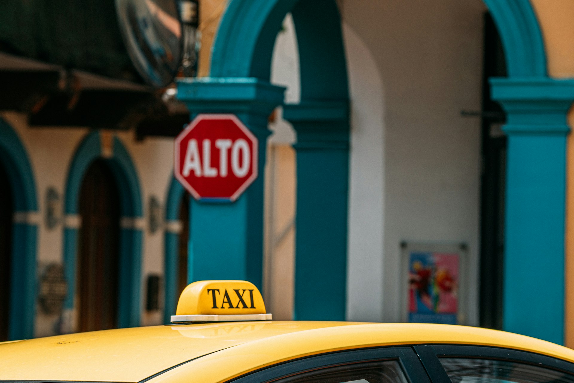 A taxi waiting outside a building in Panama City