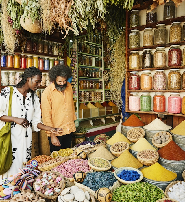 Wide shot of couple shopping in spice shop in the souks of Marrakech while on vacation
1464913108
exotic travel