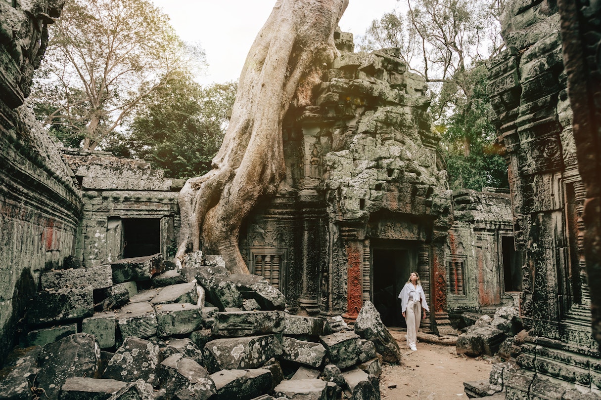 Traveler Exploring Ancient Ruins of Ta Prohm Temple at Angkor
1469688108