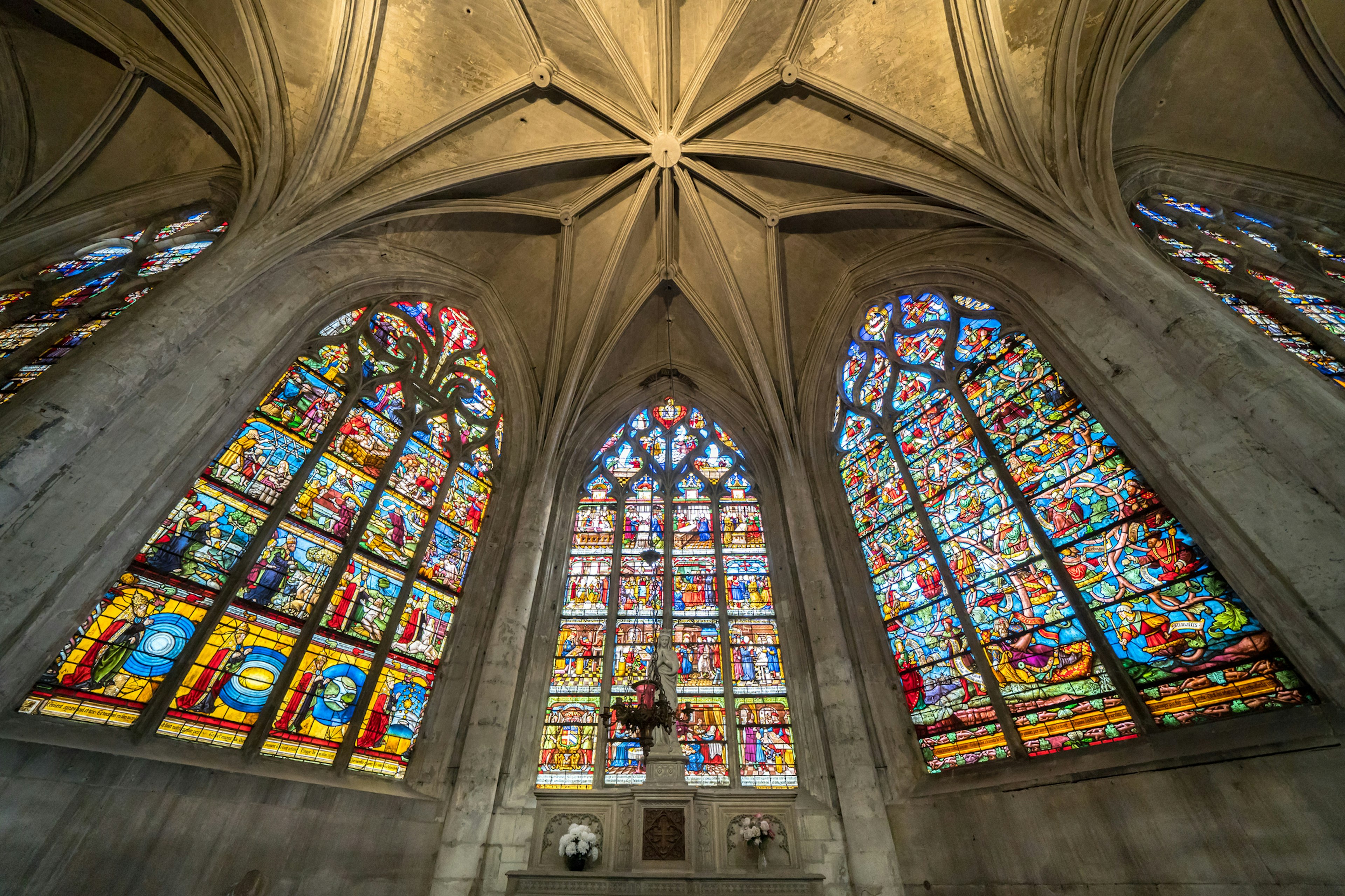 Vast colorful stained-glass windows in a church