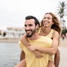 the woman is climbing on the man's back as she hugs him and they are both laughing. they are on the beach pier.
Preselect summer friends
1498188341