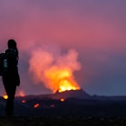 dpatop - 21 July 2023, Iceland, Fagradalsfjall: Lava erupts from the crater of a volcano near the mountain Litli-HrÃºtur, about 40 kilometers southwest of Reykjavik. A young woman stands in the foreground, gazing at the flames. Iceland has seen a volcanic eruption for the third year in a row. Photo: Philipp Schulze/dpa (Photo by Philipp Schulze/picture alliance via Getty Images)
dpatop - 21 July 2023, Iceland, Fagradalsfjall: Lava erupts from the crater of a volcano near the mountain Litli-Hrútur, about 40 kilometers southwest of Reykjavik. A young woman stands in the foreground, gazing at the flames. Iceland has seen a volcanic eruption for the third year in a row. Photo: Philipp Schulze/dpa (Photo by Philipp Schulze/picture alliance via Getty Images)
1546721678
volcanoes, free time, observer, smartphone, smoke