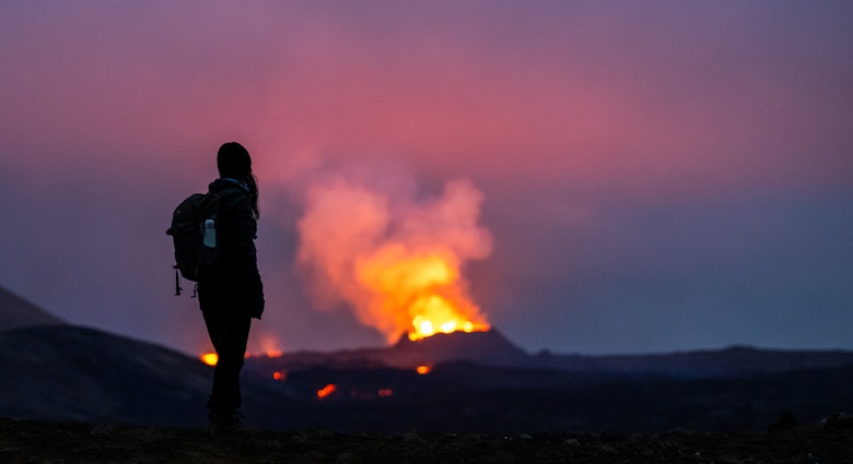 dpatop - 21 July 2023, Iceland, Fagradalsfjall: Lava erupts from the crater of a volcano near the mountain Litli-HrÃºtur, about 40 kilometers southwest of Reykjavik. A young woman stands in the foreground, gazing at the flames. Iceland has seen a volcanic eruption for the third year in a row. Photo: Philipp Schulze/dpa (Photo by Philipp Schulze/picture alliance via Getty Images)
dpatop - 21 July 2023, Iceland, Fagradalsfjall: Lava erupts from the crater of a volcano near the mountain Litli-Hrútur, about 40 kilometers southwest of Reykjavik. A young woman stands in the foreground, gazing at the flames. Iceland has seen a volcanic eruption for the third year in a row. Photo: Philipp Schulze/dpa (Photo by Philipp Schulze/picture alliance via Getty Images)
1546721678
volcanoes, free time, observer, smartphone, smoke