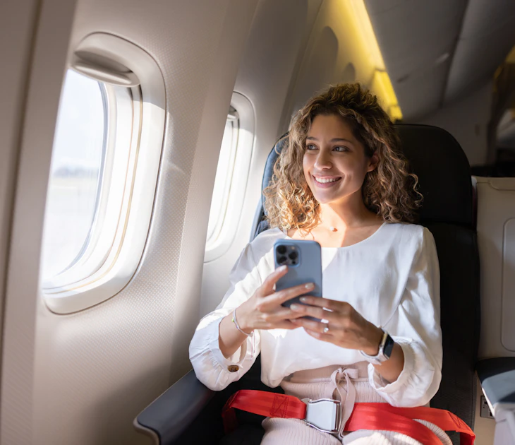 Latin American female traveler using her cell phone in an airplane and looking through the window
1691534153
entertainment
Female traveler using her cell phone in an airplane - stock photo
Latin American female traveler using her cell phone in an airplane and looking through the window