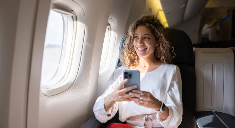 Latin American female traveler using her cell phone in an airplane and looking through the window
1691534153
entertainment
Female traveler using her cell phone in an airplane - stock photo
Latin American female traveler using her cell phone in an airplane and looking through the window