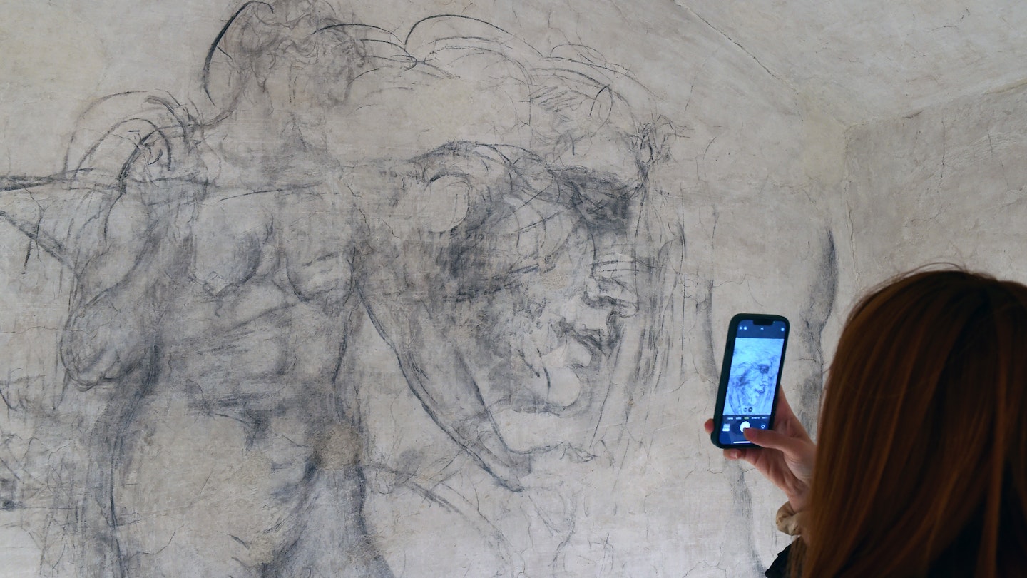 FLORENCE, ITALY - OCTOBER 31: A visitor photographs charcoal drawings inside "Michelangelo's Secret Room" at the Medici Chapel Museum on October 31, 2023 in Florence, Italy. The secret room, a 33-by-10 foot space containing charcoal drawings attributed by some experts to Michelangelo, was discovered in 1975, when officials were searching for a new exit from the Medici Chapel to accommodate increasing visitors. (Photo by Roberto Serra - Iguana Press/Getty Images)
1766927241