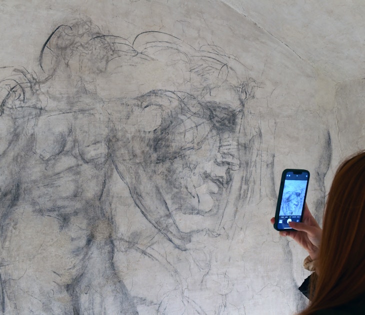 FLORENCE, ITALY - OCTOBER 31: A visitor photographs charcoal drawings inside "Michelangelo's Secret Room" at the Medici Chapel Museum on October 31, 2023 in Florence, Italy. The secret room, a 33-by-10 foot space containing charcoal drawings attributed by some experts to Michelangelo, was discovered in 1975, when officials were searching for a new exit from the Medici Chapel to accommodate increasing visitors. (Photo by Roberto Serra - Iguana Press/Getty Images)
1766927241