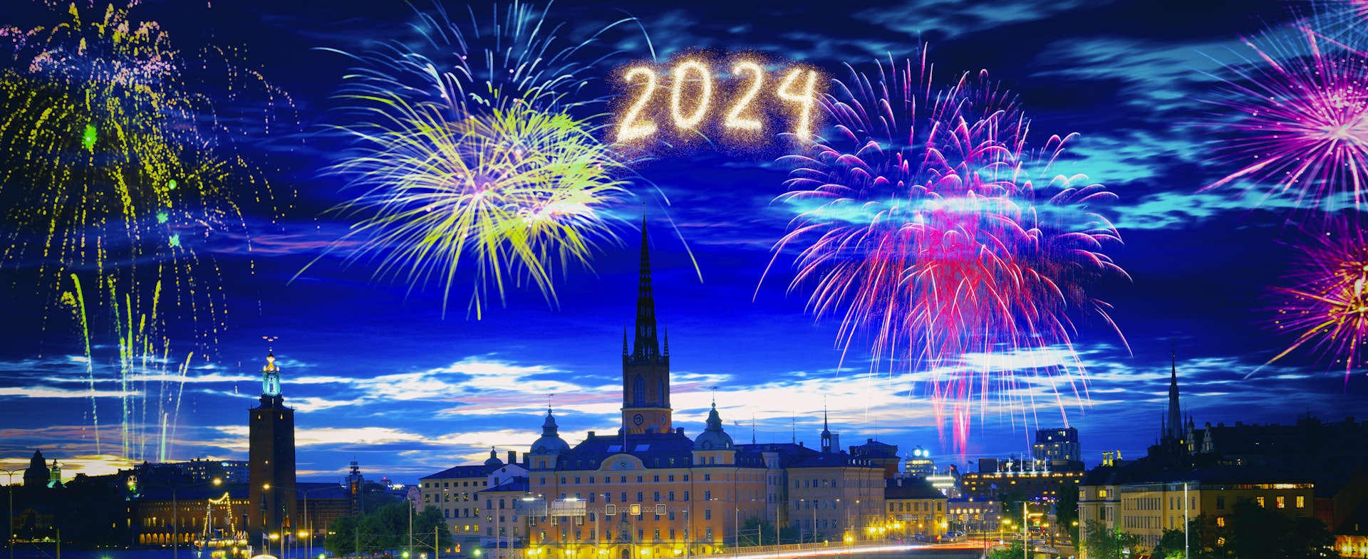 The Stockholm skyline at night, illuminated by fireworks with "2024" depicted.