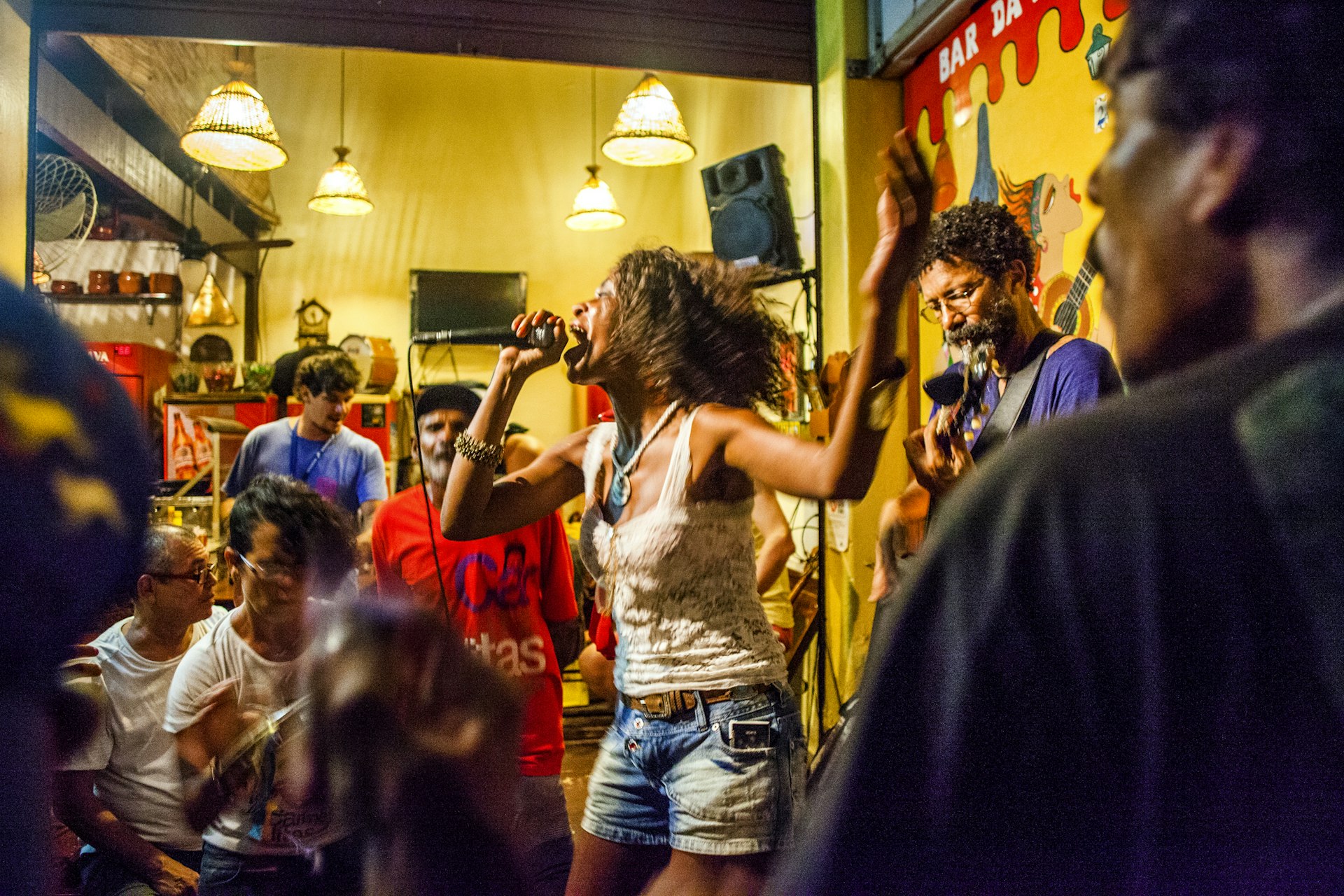 A woman singing in a busy bar in Rio de Janeiro, Brazil