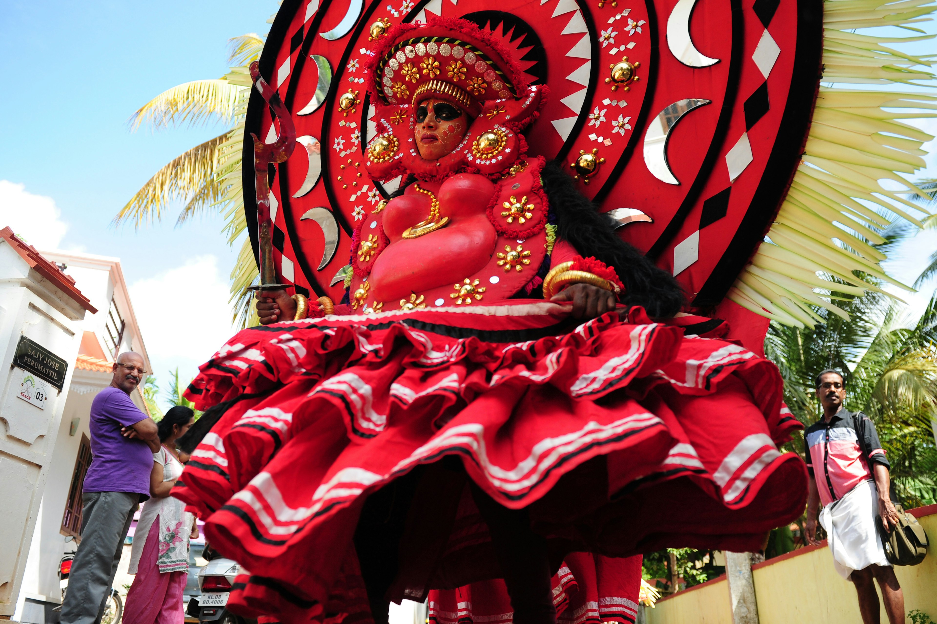 An Indian Theyyam artist performs during the Kummati Kali as part of the annual Onam festival celebrations in Thrissur, Kerala, India