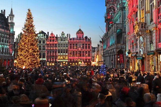 A large city square lit up at Christmas time