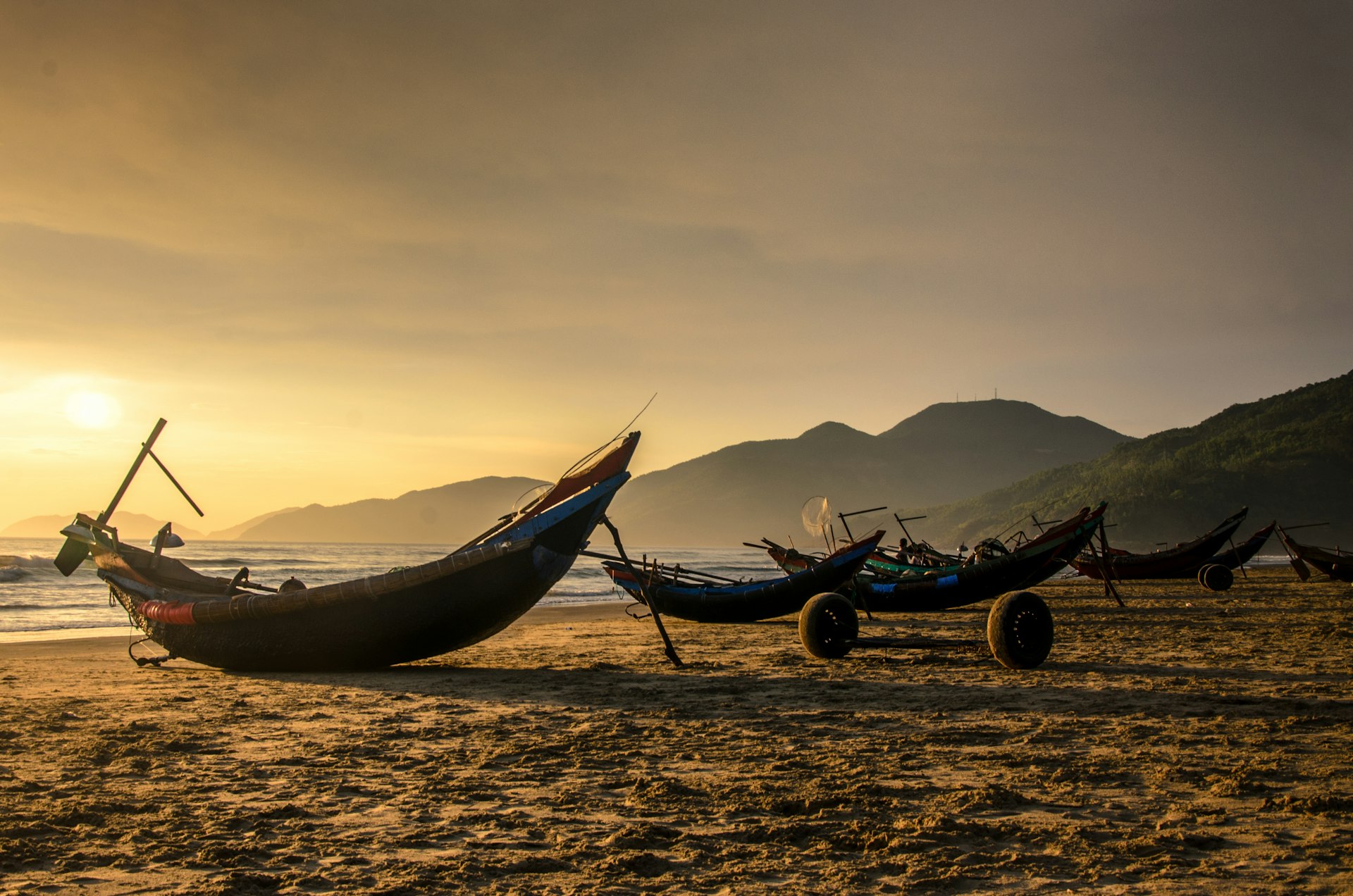 Fishing boats on the beach at sunrise, Lang Co, Hue, Vietnam