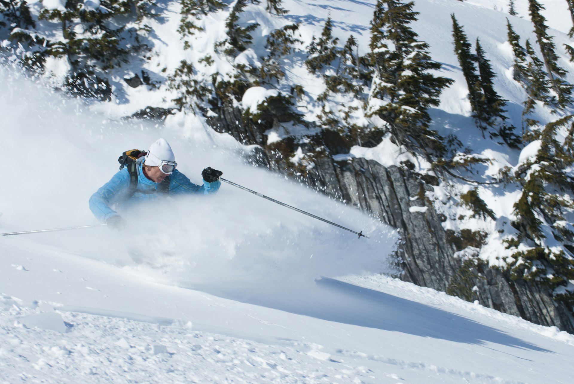 A skier making a turn in fluffy powder snow, Whistler, British Columbia, Canada