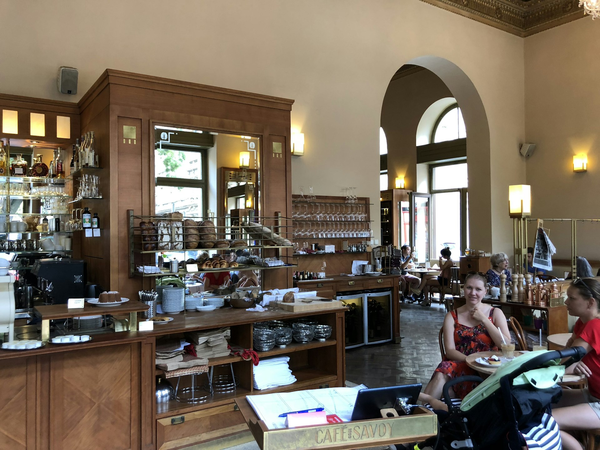 Café Savoy Prague interior with customers sat at tables