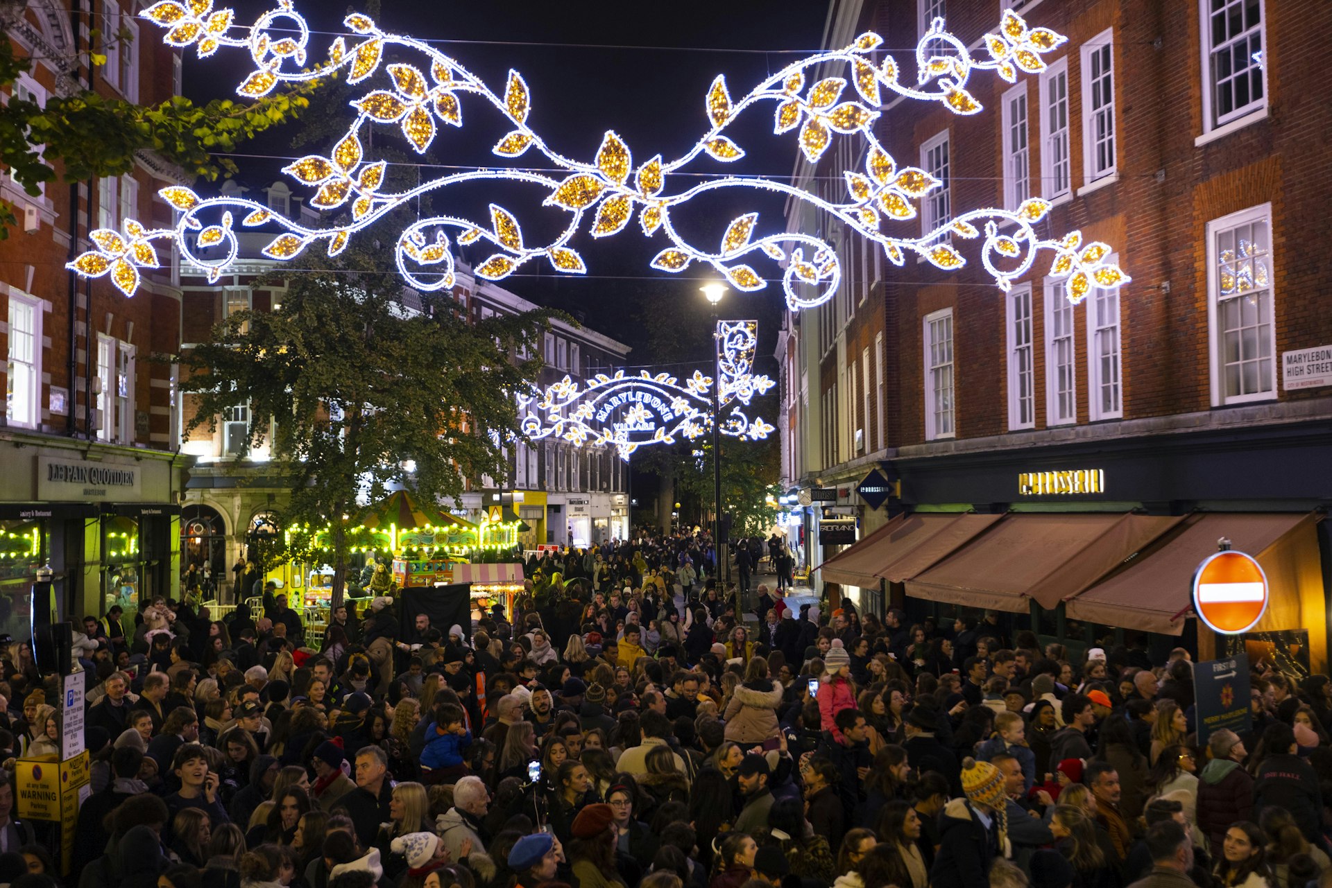 Members of the public watch the Merry Marylebone Christmas lights being switched on in London, England, UK