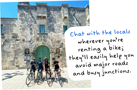 Chat with the locals wherever you're renting a bike; they'll easily help you avoid major roads and busy junctions. Image of four women standing with their bikes.