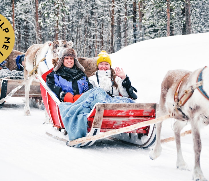 Rovaniemi, Finland - March 3, 2017: Girls at Reindeer sleigh in Finland in Lapland in winter.