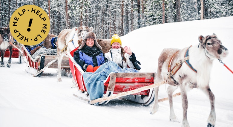 Rovaniemi, Finland - March 3, 2017: Girls at Reindeer sleigh in Finland in Lapland in winter.