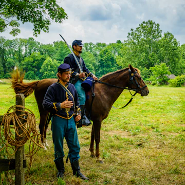 Lancaster, PA, USA July 16, 2022: Union Armys Cavalry Soldiers explain their duties and tactics to visitors at the Landis Valley Farm Museum during the Civil War Weekend Event.
1409333857
america, american, attraction, camp, civil, county, demonstration, encampment, lancaster, landis, pa, reenactor, soldiers, tents, union, us