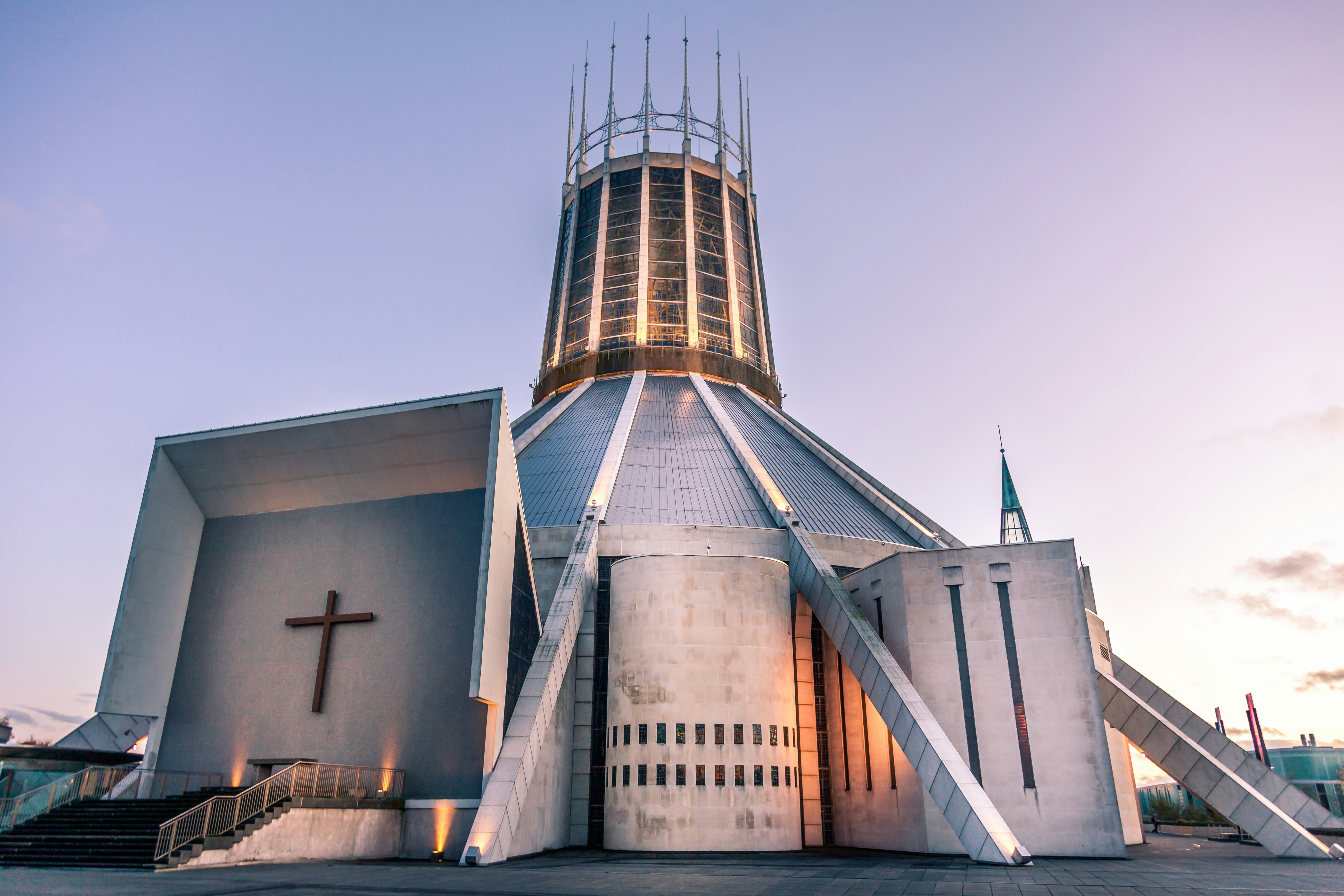 Front view of the Roman Catholic Liverpool Metropolitan Cathedral with stained glass panels at the base of the steps in the foreground, Liverpool, Merseyside, England.