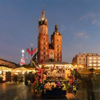 Stalls with Christmas lights in Krakow's Market Square