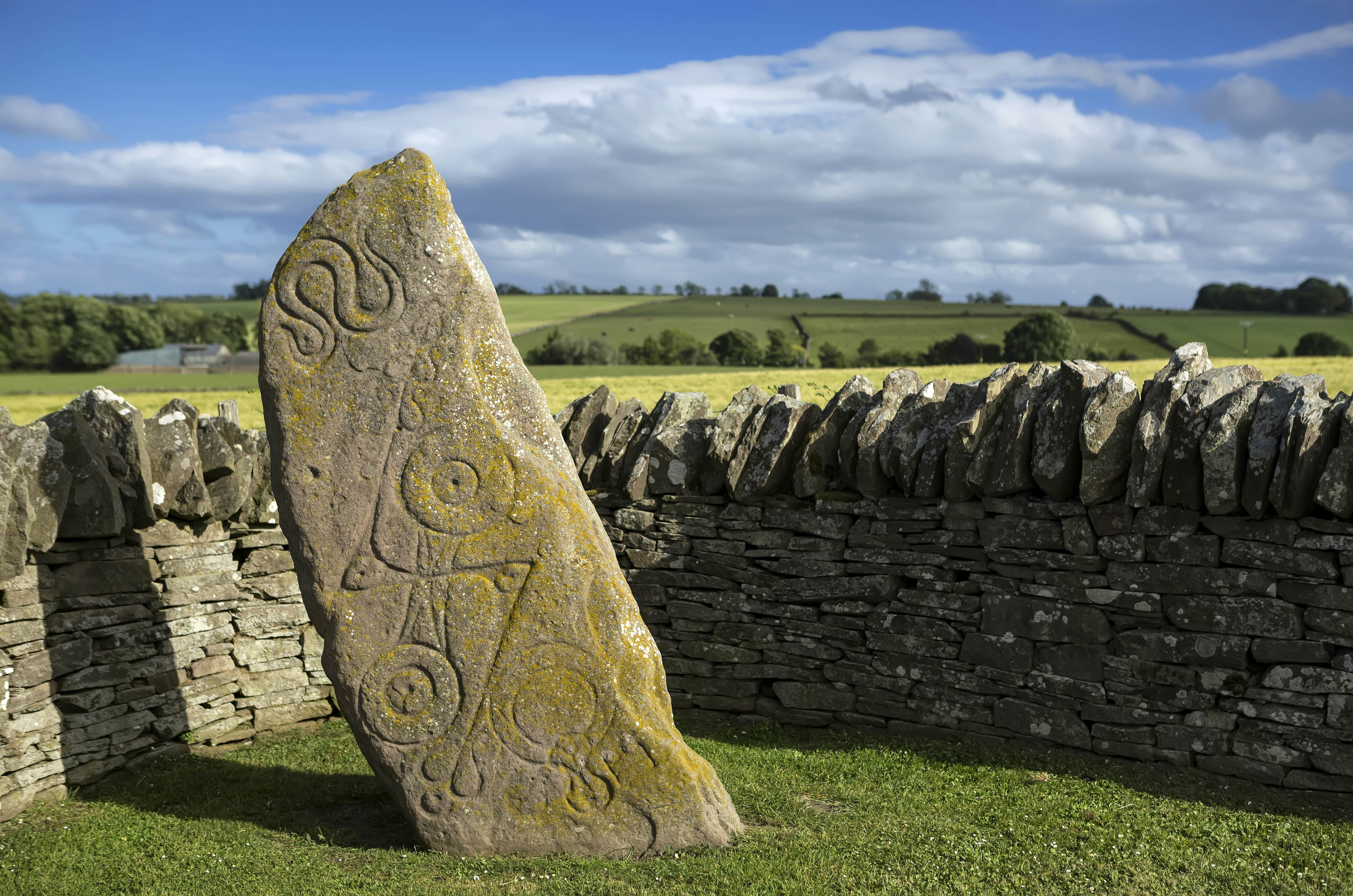 Aberlemno Pictish Stone in Scotland
1124293226
aberlemno, ancient, angus, archeology, art, britain, british, building, carved, celtic, church, culture, design, detail, exterior, heritage, historic, history, incised, landmark, landscape, medieval, monument, mystic, old, outdoor, pattern, pict, pictish, pictish stone, religion, roadside cross, rock, ruin, sandstone, scotland, scottish, sculpture, sky, standing, statue, stone, surface, symbol, texture, tourism, traditional, travel, uk, weathered