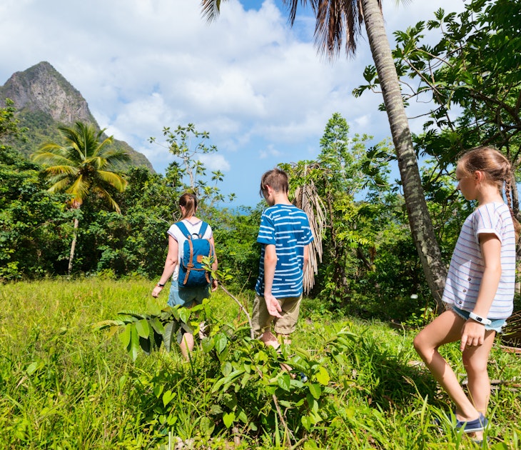 Family of mother and kids hiking on summer day at tropical island; Shutterstock ID 1155348274; full: 65050; gl: Online Editorial; netsuite: St Lucia with kids; your: Tasmin Waby
1155348274
