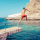 Man jumping to the sea at Xlendi beach at island Gozo, Malta
1356997409