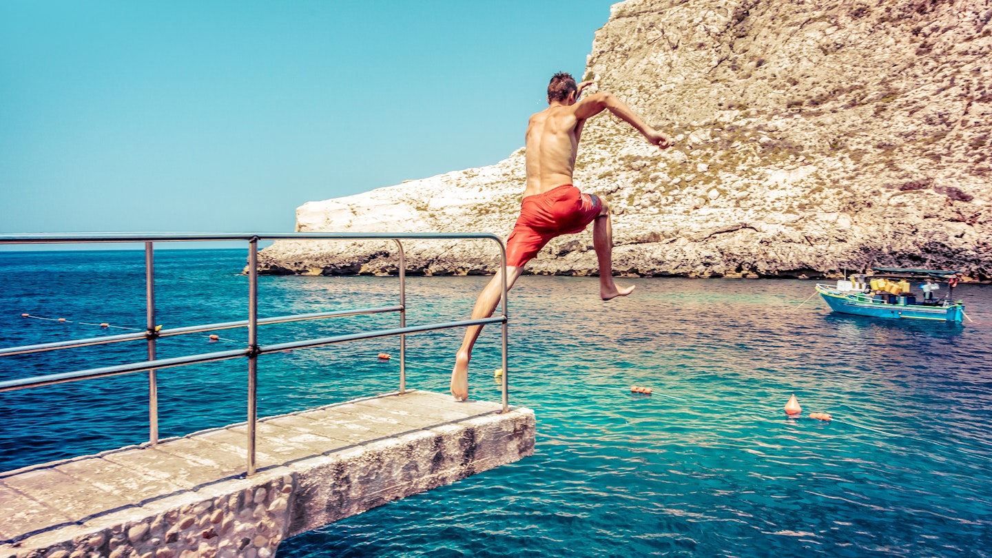 Man jumping to the sea at Xlendi beach at island Gozo, Malta
1356997409