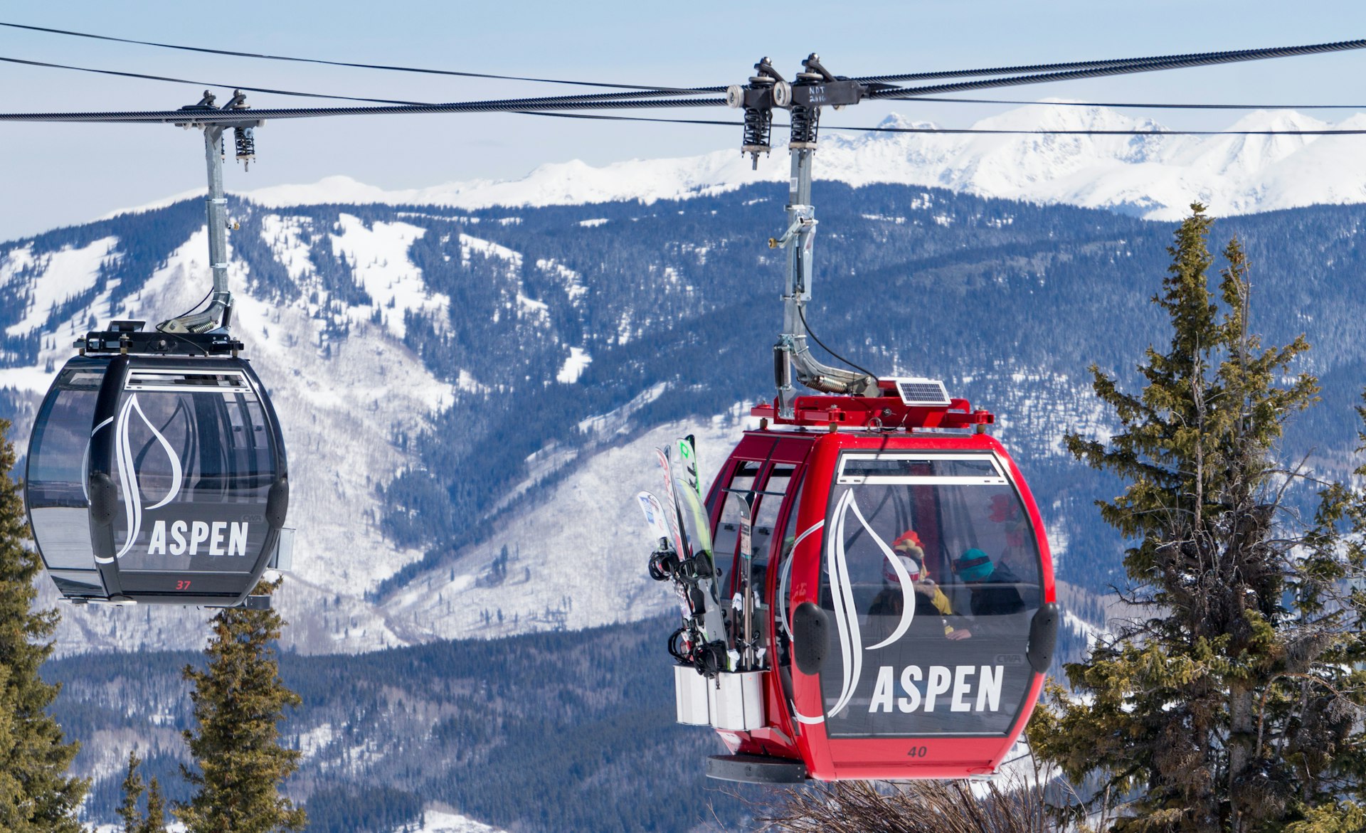 Gondolas delivering skiers in Aspen, Colorado, USA