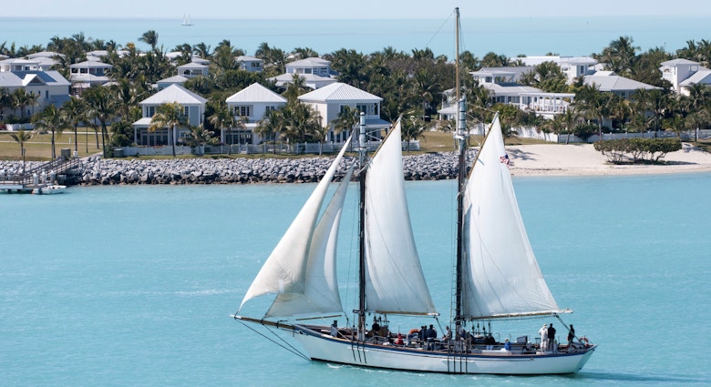 The sailing ship passing by the artificial residential island Sunset Key in Key West town (Florida).; Shutterstock ID 1587813181; full: 65050; gl: Lonely Planet Online Editorial; netsuite: 10 best warm-weather spots in USA; your: Brian Healy
1587813181
architecture, artificial, boat, caribbean, destination, florida, holiday, home, horizon, house, island, journey, key west, leisure activity, nature, nautical, places, residential, sail, sailboat, sea, ship, sky, south, suburb, tourism, transport, transportation, travel, tropical, united states, usa, vacation, vessel, voyage, water, yacht