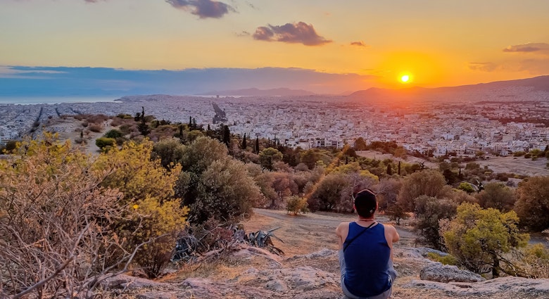 Tourist man watching the sunset over city of Athens seen from Filopappou Hill (hill of muses), Athens, Attica, Greece, Europe. Athens cityscape and Aegean sea. Beautiful sunset point with aerial view; Shutterstock ID 2322198929; full: 65050; gl: Online editorial; netsuite: Athens things to do; your: Claire Naylor
2322198929