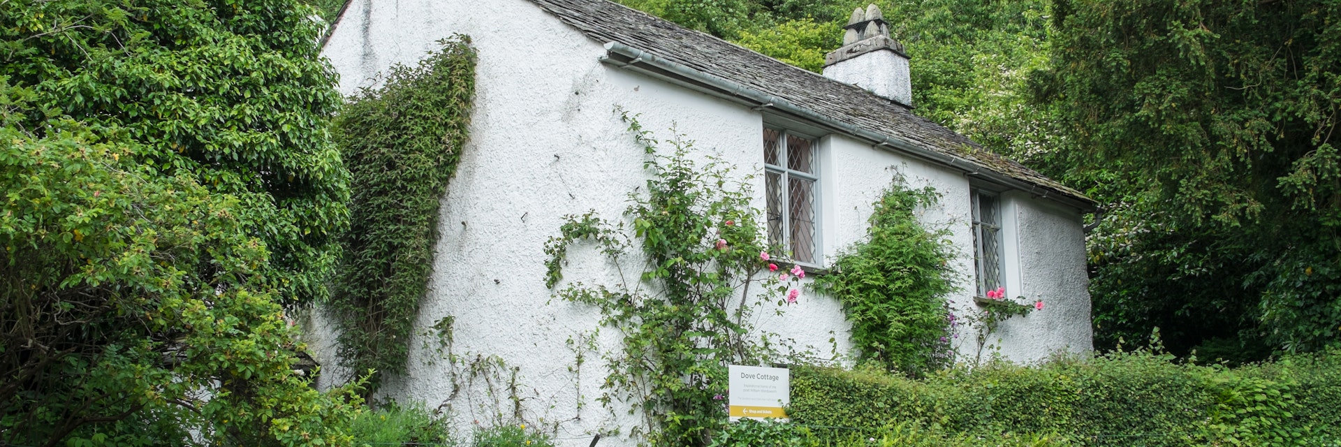 Grasmere, Lake District, UK - June 2017: Dove Cottage - picturesque home of the poet William Wordsworth.
690001708