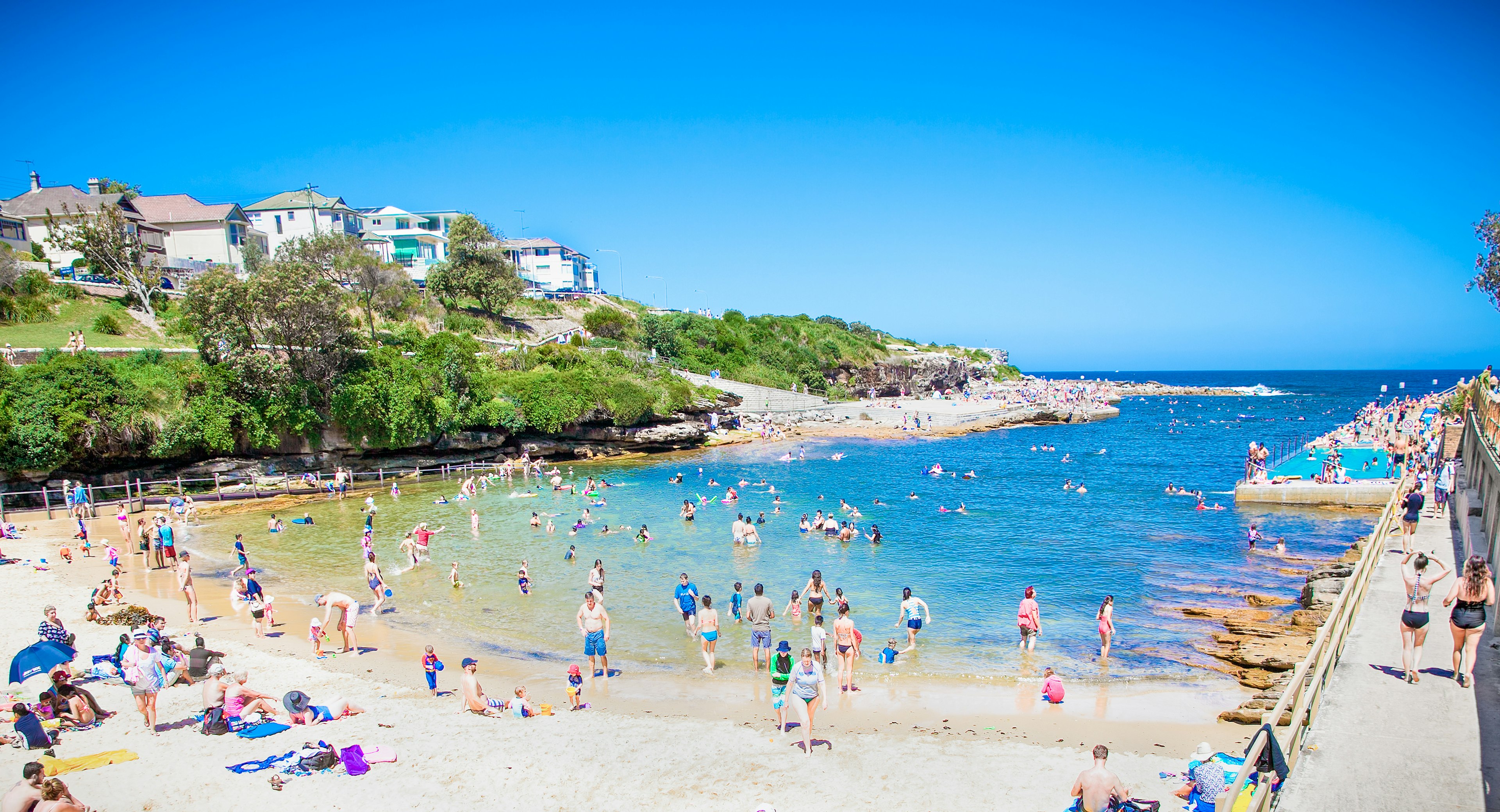 People relaxing at Clovelly sandy beach in Sydney