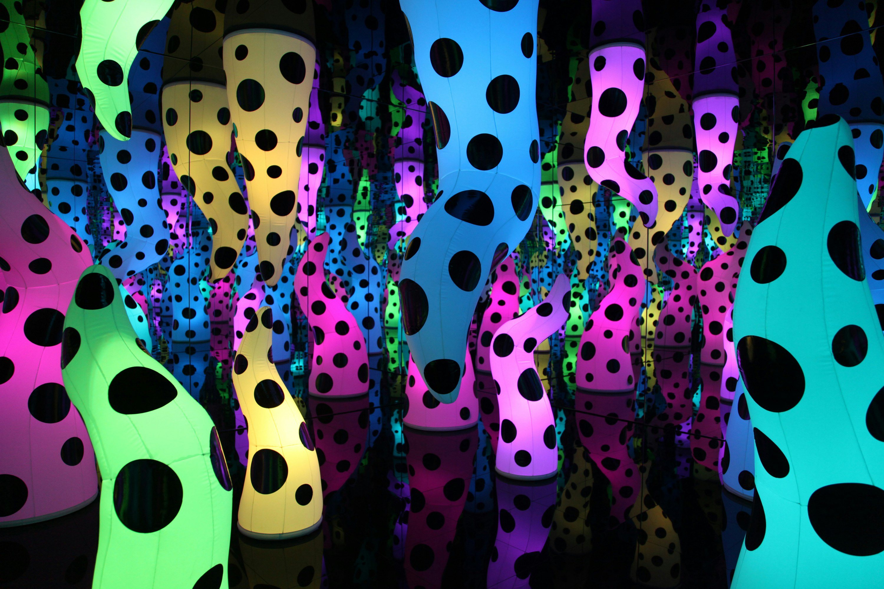 Yayoi Kusama’s “LOVE IS CALLING” installation, with multicolored, polka-dotted pieces that look like stalactites and stalagmites