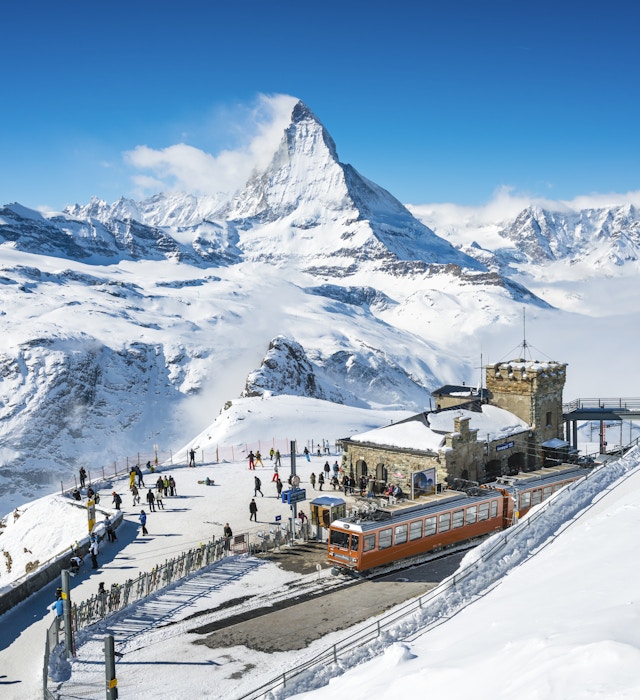 Gornergrat railway station Switzerland in winter
People at Gornergrat railway station (3.089 m) with Matterhorn peak above Zermatt town in Mattertal, Valais canton, Switzerland, in winter © mbbirdy / Getty