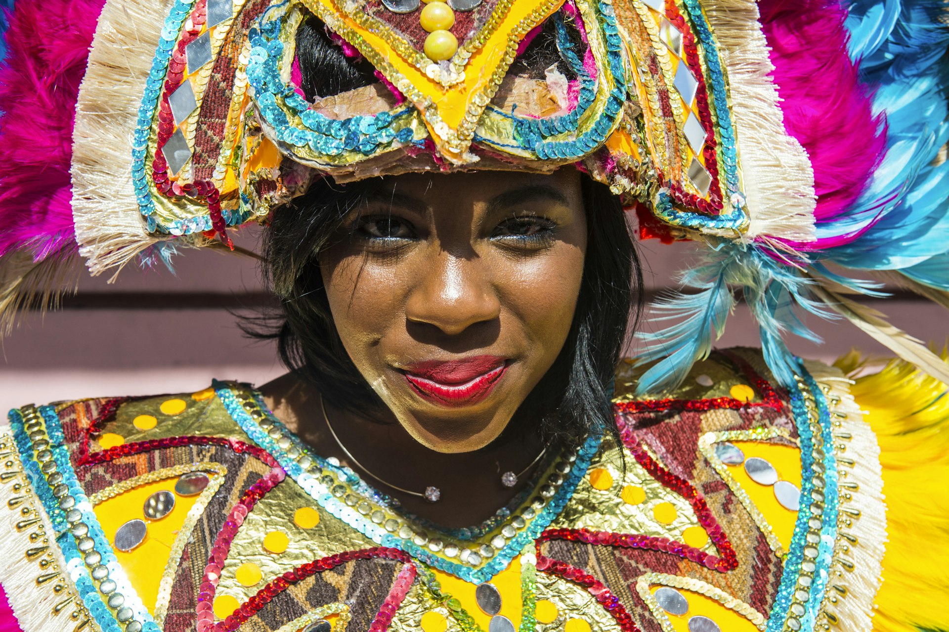 A woman dressed up in bright colours for the junkanoo festival in the Bahamas