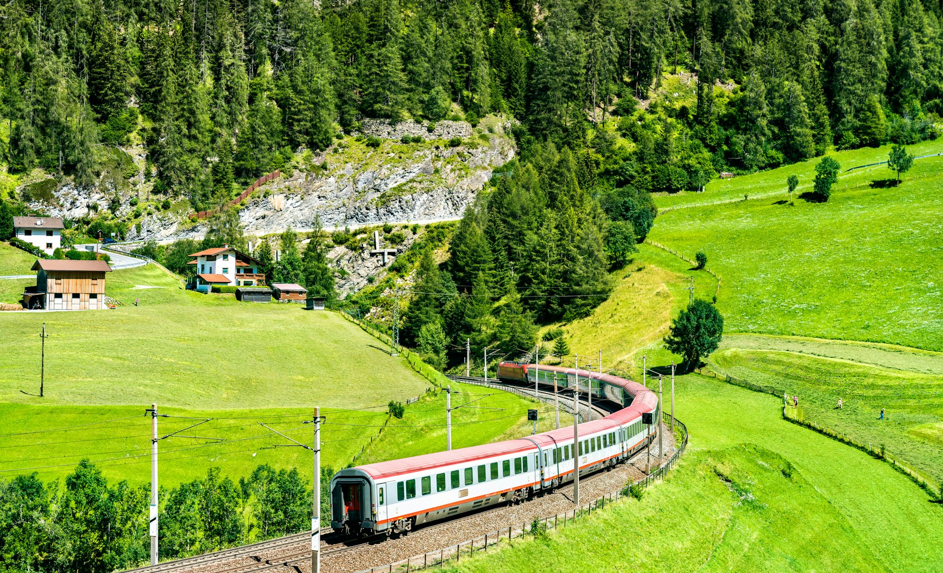 A passenger train on the Brenner Railway in the Austrian Alps