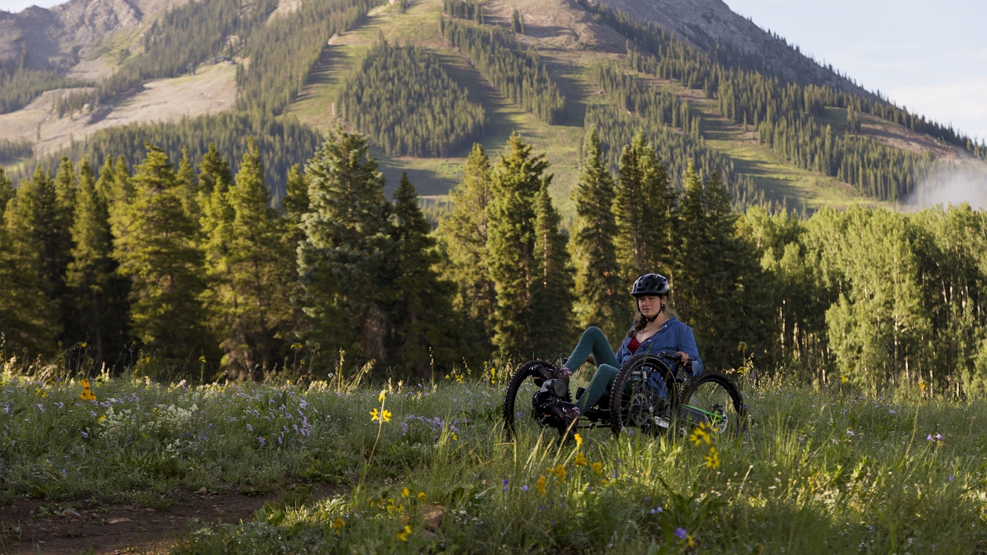 A disabled woman stops to see the beautiful view while riding a tri-bike path in the mountains of the Colorado Rockies as fog moves in the background from the valley below.
1360219293
