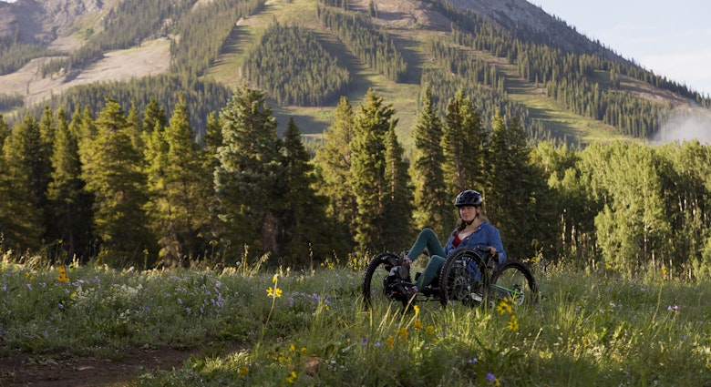 A disabled woman stops to see the beautiful view while riding a tri-bike path in the mountains of the Colorado Rockies as fog moves in the background from the valley below.
1360219293