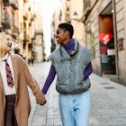 Happy mutiethnic lesbian tourist couple walking along a street in Barcelona city
1457851407