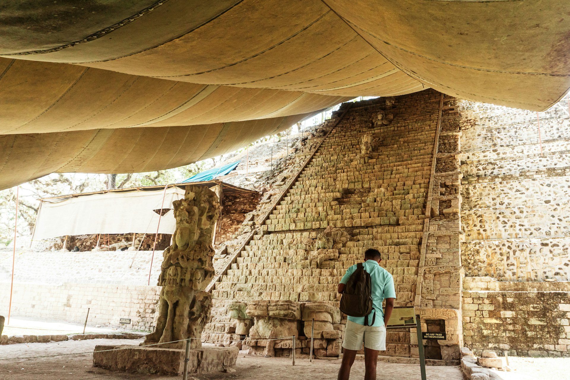 Man visiting the Maya pyramids and temples in the archaeological park of Copán Ruinas, Honduras