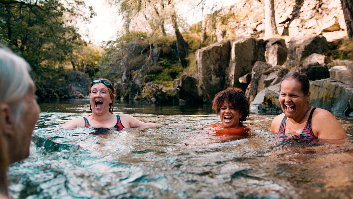Group of women wild swimming in the Lake District, North East of England. They are in a river, enjoying time outdoors.
1492282538