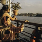 portrait of happy  couple  who travels on a boat during sunset on nile river, Cairo
1548334640