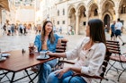 Two young female friends drinking coffee in a sidewalk cafÃ© in Dubrovnik, Croatia.
Two young female friends drinking coffee in a sidewalk café in Dubrovnik, Croatia.
1550680815
