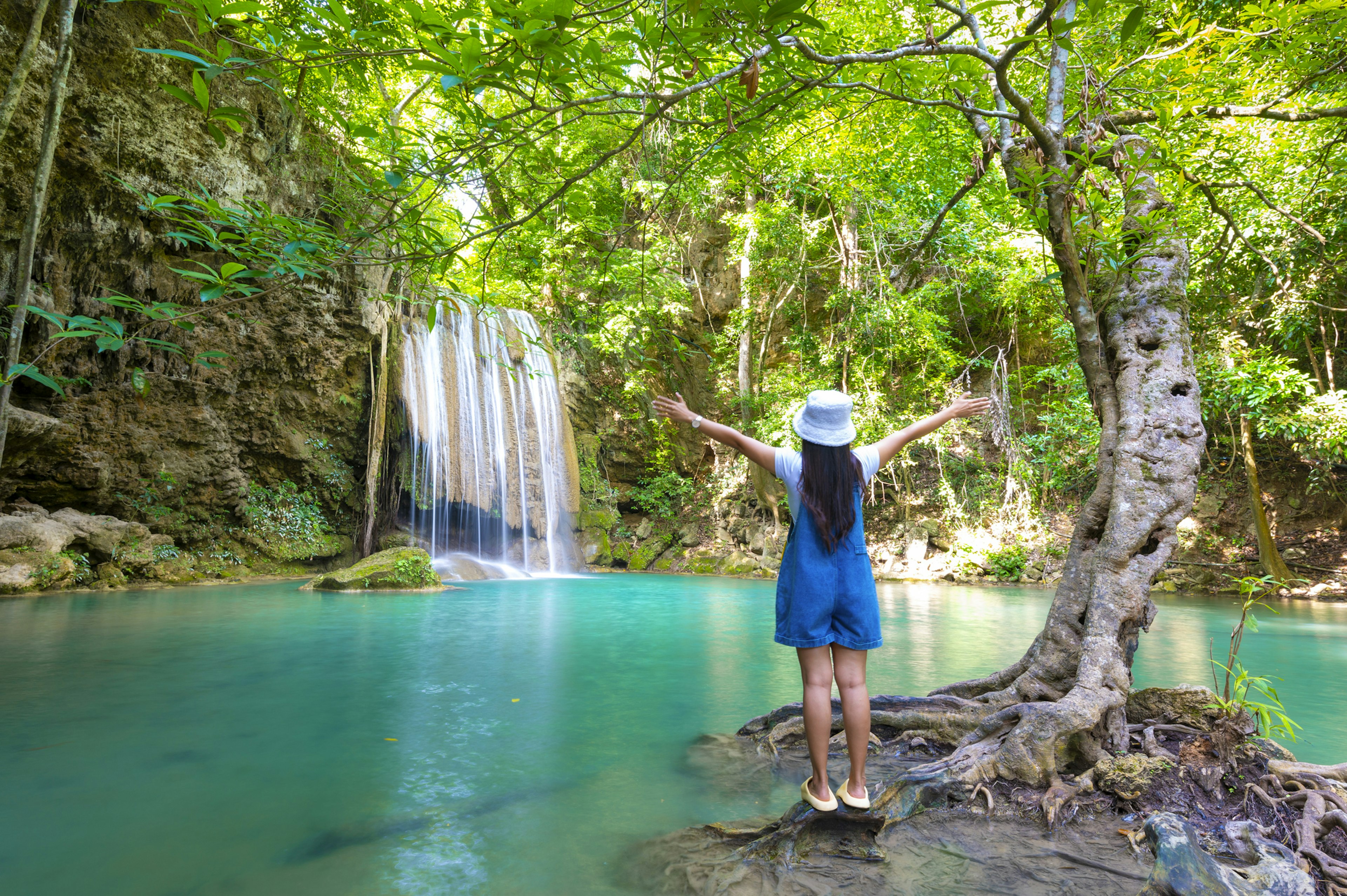 A family enjoying a waterfall in Thailand