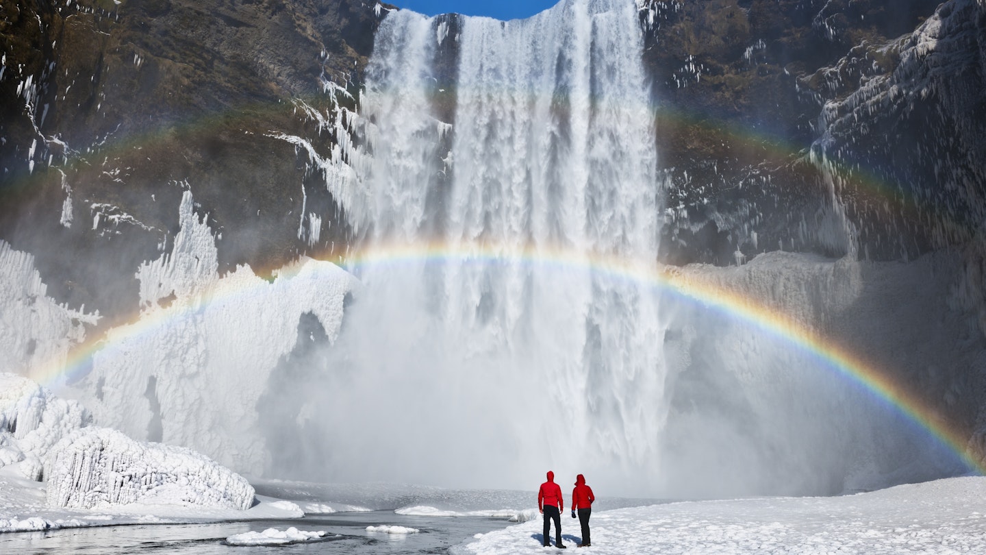 Couple under a rainbow by a large waterfall, winter. Skogafoss, Iceland.
173070430
awe, enjoyment, majestic, scale, romantic
Waterfall and rainbow with couple - stock photo
Couple under a rainbow by a large waterfall, winter. Skogafoss, Iceland © Jeremy Walker / Getty