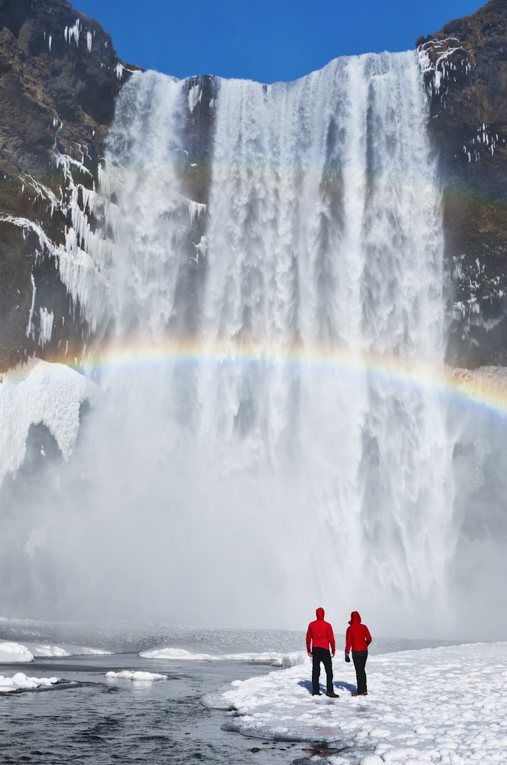 Couple under a rainbow by a large waterfall, winter. Skogafoss, Iceland.
173070430
awe, enjoyment, majestic, scale, romantic
Waterfall and rainbow with couple - stock photo
Couple under a rainbow by a large waterfall, winter. Skogafoss, Iceland © Jeremy Walker / Getty