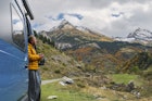A mature man, parked up in his campervan above Gavarnie in the Hautes-Pyrenees, takes in the view of the surrounding mountains. He wears a yellow puffer jacket and holds a hot drink.
1776564269
pic du piméné