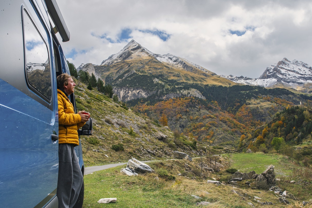 A mature man, parked up in his campervan above Gavarnie in the Hautes-Pyrenees, takes in the view of the surrounding mountains. He wears a yellow puffer jacket and holds a hot drink.
1776564269
pic du piméné